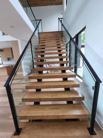 Wood staircase with glass railing