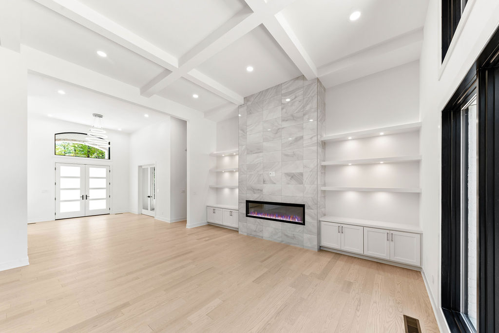 All white living room with fireplace