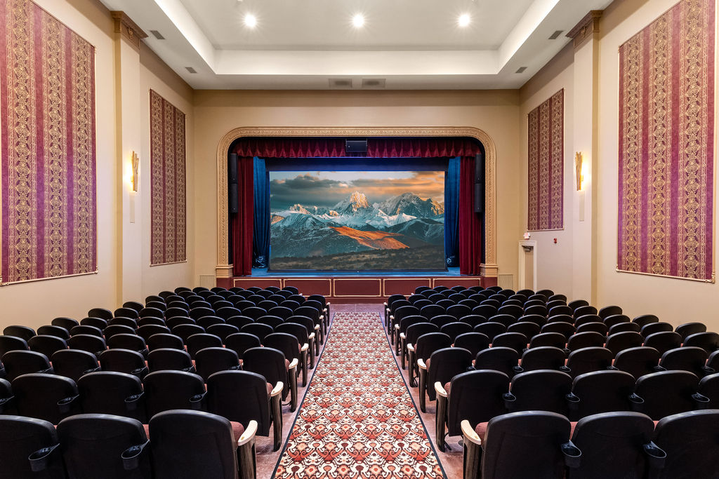 Movie theater view of screen from seating area